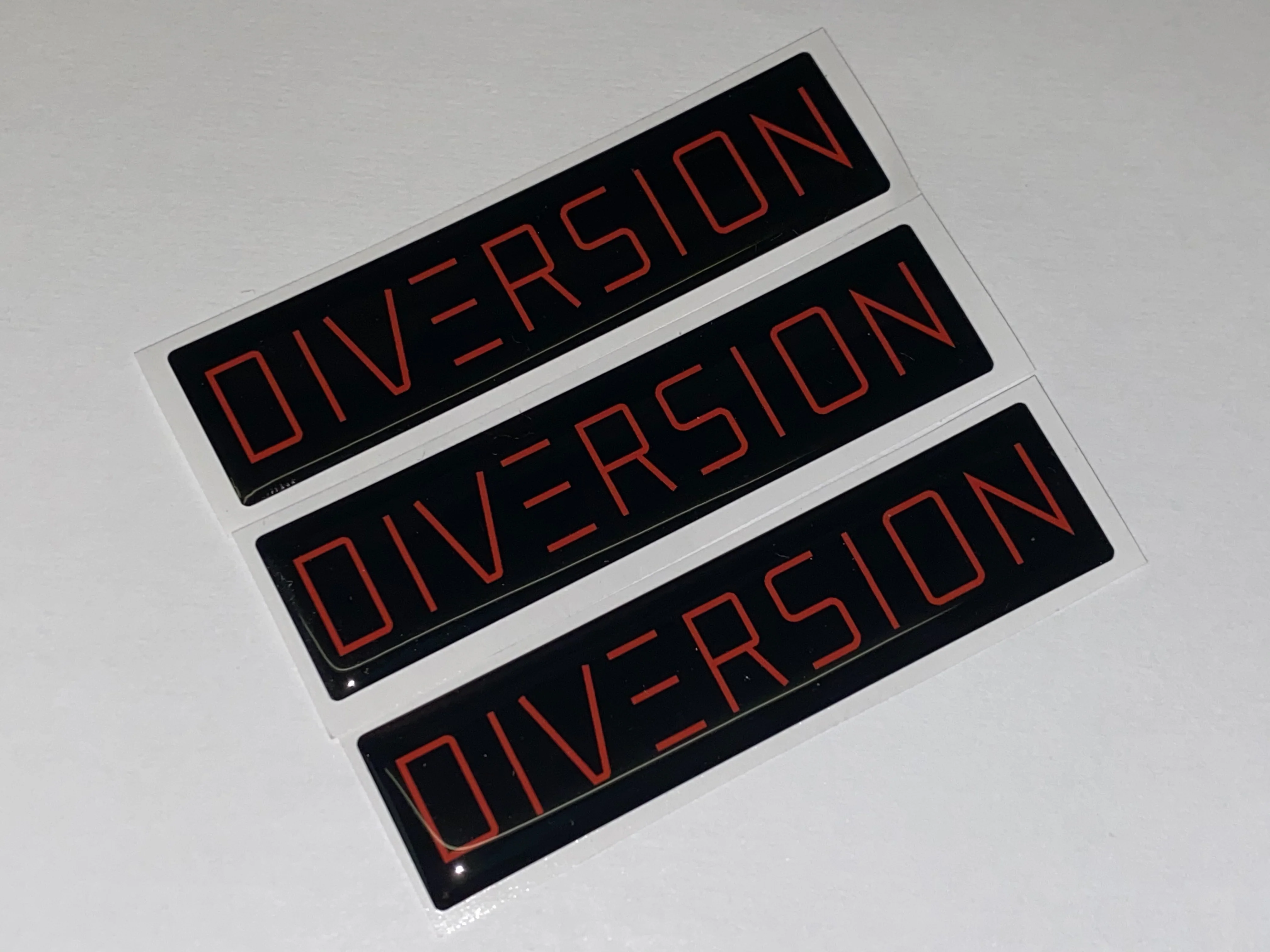 DIVERSION Red Gel Badge / Self Adhesive (8cm x 2cm) - Image 3